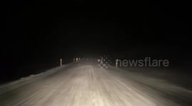 Driving on Icelandic highway in snowy conditions