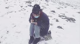 Chinese student braves snow to find signal to access online lessons during COVID-19 outbreak