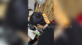 Chinese teacher creates phone holder by himself so he can live stream lessons to students due to coronavirus lockdown