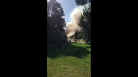 Car on fire with thick smoke