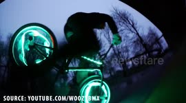 Parkour and BMX athletes perform impressive stunts with LED lights in tyres
