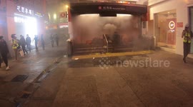 Hong Kong protesters set fire to a barricade and ask fire brigade not to extinguish it
