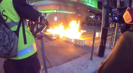 Protesters set fire to a barricade on Nathan road