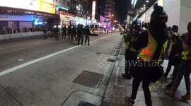 Police shoot tear gas as they withdraw on Nathan road