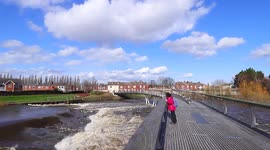 A raging River Aire runs through Castleford in Yorkshire after recent storms