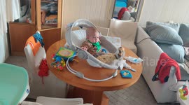 Dad playing with baby