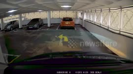 Silly lady 'beaches' her car on bright yellow stone in multistory car park - funny