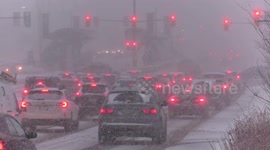Heavy snow and blizzard conditions bring rush hour traffic to a standstill just north of Toronto as lake effect snow squalls and high wind hit southern Ontario Canada
