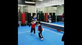 5 year old boy sparring in taekwondo