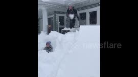 Child cannonballs into huge Canadian snowdrift