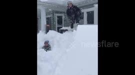 Child cannonballs into huge Canadian snowdrift