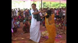 Couples dance and kiss before south Indian shrine to bring good luck