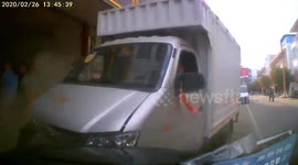 Truck plunges into parked vehicles after trying to avoid boy crossing road in China