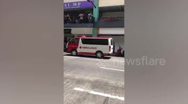 Armed police surround shopping mall after gunman shoots one and takes 30 hostages in Manila, Philippines