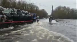 Tractors and jet skis share flooded roads in Ireland after Storm Jorge's rainfall