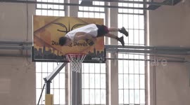 Slovenian stuntmen perform flips and basketball dunks in abandoned playground