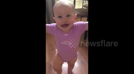 Adorable toddler determined to take her first steps goes viral online