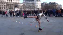 Roller dancer entertains crowds in Trafalgar Square in London