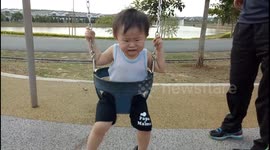 Hilarious toddler terrified of riding a swing set