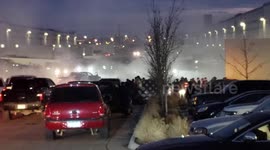 Street racers take over a parking lot