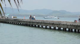 Tourists visiting Thai island enjoy unusual motorcycle sidecar taxis