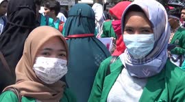 Indonesian students and police wear masks amid coronavirus outbreak