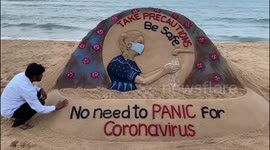 Indian artist creates sand sculpture to spread awareness about coronavirus in eastern India