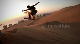 Amazing sandboarders surf the dunes in Chilean desert city