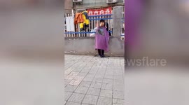 Hairdresser cut customer's hair through guardrails of quarantined Chinese community amid COVID-19 outbreak