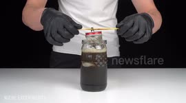 Serbian YouTubers break down the layers of a Coca-Cola can with drain cleaner