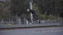 Bike rider rolling on front wheel!! Crazy Balance