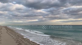 Dramatic cloudy sunrise and crepuscular rays from Hollywood Beach, Florida
