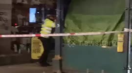 Drunk Man Is Taken Away From The Scene Of A Fire In London