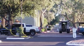 Man takes hostage with gun and possible bomb. Away and the bomb squad responded and a standoff ensued