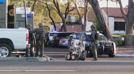 Police prepare bomb disposal robot to go into hostage situation