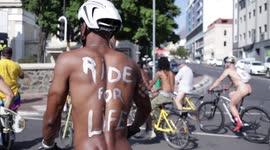 Climate activists cycle through Cape Town streets naked