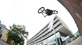 BMX Biker jumps over Cameraman