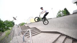 BMX Bike Rider jumps big Stair Gap!