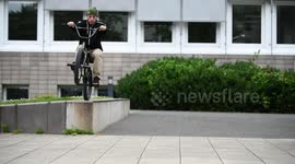Young Man does BMX Bike Grind & Wheelie