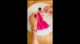 TikTok food artist styles LIZZO in a HOT PINK edible DRESS