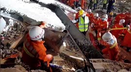 Firefighters rescue suspected coronavirus patients after hotel in southern China collapses
