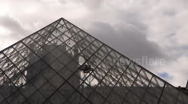 aning robot cleaning glass pyramid of Louvre museum.