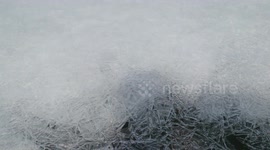 crack on the ice in Baikal lake. melting ice