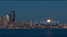 Timelapse footage captures Super Worm Moon rising above Seattle skyline