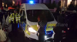 Protesters block police van during anti-fascist rally outside Greek Embassy in London