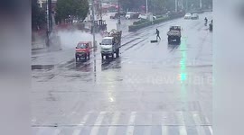 Oxygen cylinder smashes into biker after dropping from transport truck in China