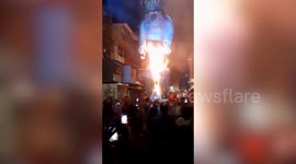Mumbai people burn effigy of 'coronavirus monster' during Holi festival
