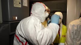 Gerogian citizens have their temperature checked at airport after flying from Rome