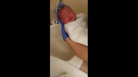 new born baby in las vegas having her first bath