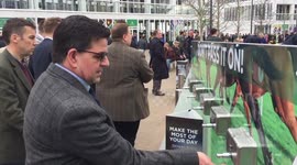 Cheltenham Festival-goers use hand sanitiser stations as crowd numbers down due to coronavirus concerns